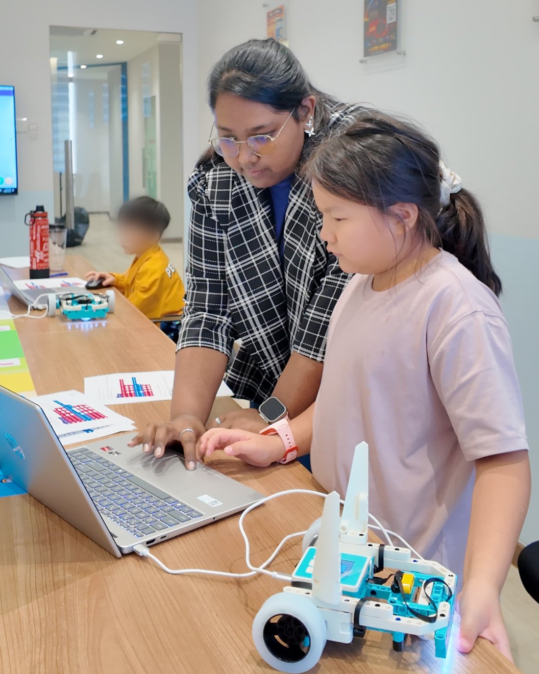 Fine-tuning the code until the robot gets it right.